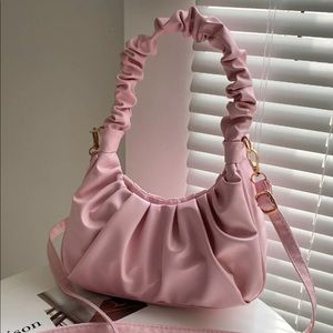 Pink ruched shoulder bag with crossbody strap